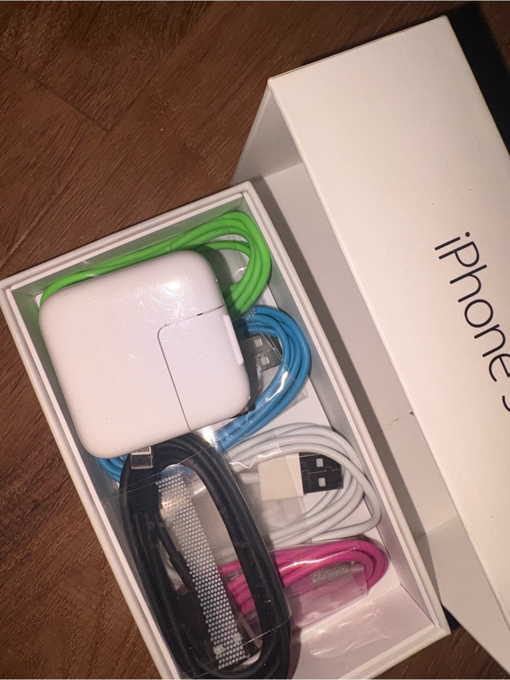 5 collared USB to type A iPhone charging cords and a USB charging block